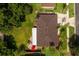 Straight down aerial view of a house showing roof, yard, and surrounding greenery at 5162 Tellson Pl, Orlando, FL 32812