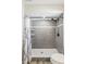Bathroom features a walk-in shower with gray tile, and modern fixtures at 5162 Tellson Pl, Orlando, FL 32812