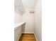 A walk-in closet featuring wood flooring and multiple white shelves for ample storage at 5162 Tellson Pl, Orlando, FL 32812