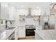 Close up on the kitchen features white subway tile backsplash and stainless steel appliances at 5162 Tellson Pl, Orlando, FL 32812