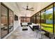 A covered lanai with tile flooring, ceiling fans, and views of the backyard at 5162 Tellson Pl, Orlando, FL 32812