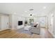 Stylishly decorated living room with ample seating, natural light, and sleek, modern furnishings at 5162 Tellson Pl, Orlando, FL 32812