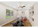 Cozy room that has a large window, hardwood floors, and a wall with a built-in shelf at 5162 Tellson Pl, Orlando, FL 32812