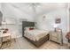 Cozy bedroom with a well-designed bed, desk and good natural light at 525 Hardwood Cir, Orlando, FL 32828
