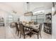 Elegant dining area featuring a modern chandelier and seating for six at 525 Hardwood Cir, Orlando, FL 32828