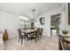 Dining area showcases a modern chandelier with stylish table decor at 525 Hardwood Cir, Orlando, FL 32828