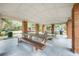 Covered picnic area with brick columns and long wooden picnic tables at 525 Hardwood Cir, Orlando, FL 32828