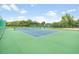 Well-maintained community tennis court with green and blue surface at 525 Hardwood Cir, Orlando, FL 32828