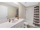 Bathroom featuring a shower-tub combo, neutral walls, white cabinets, and a white countertop with sink at 5347 Travertine St, Mount Dora, FL 32757