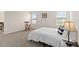 Comfortable bedroom featuring carpet flooring, a rocking chair, and natural light at 5347 Travertine St, Mount Dora, FL 32757