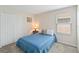 This well-lit bedroom boasts a closet, soft carpet, and ample natural light for relaxation and comfort at 5347 Travertine St, Mount Dora, FL 32757