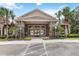 Community clubhouse featuring tile roof, stone accents, double-door entry, and accessible ramp at 5347 Travertine St, Mount Dora, FL 32757