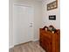 Inviting entryway featuring a front door, decorative cabinet, and neutral wall color at 5347 Travertine St, Mount Dora, FL 32757