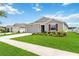 Charming single-story home with a well-manicured lawn and attached garage at 5347 Travertine St, Mount Dora, FL 32757