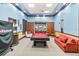 Community game room with a billiards table, comfortable seating, and a classic wood trim design at 5347 Travertine St, Mount Dora, FL 32757