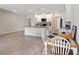 Bright eat-in kitchen with a gray countertop island and a dining area at 5347 Travertine St, Mount Dora, FL 32757