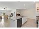 Open floor plan showcasing the kitchen island and a view into the spacious living room at 5347 Travertine St, Mount Dora, FL 32757