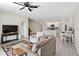 Open-concept living room featuring modern decor, neutral colors, and seamlessly connecting with the kitchen at 5347 Travertine St, Mount Dora, FL 32757