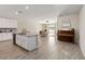 Open-concept living area with hardwood floors, a stylish piano, and lots of natural light at 5347 Travertine St, Mount Dora, FL 32757