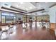 Spacious community meeting room featuring hardwood floors, natural lighting, and ample seating at 5347 Travertine St, Mount Dora, FL 32757