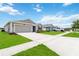 Street view showcases a community with well-kept lawns and paved driveways at 5347 Travertine St, Mount Dora, FL 32757