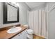Bathroom with gray wall color, vanity and shower with curtain at 561 Pinebranch Cir, Winter Springs, FL 32708