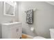 Cozy half-bathroom with white vanity, mirror and neutral wall color at 561 Pinebranch Cir, Winter Springs, FL 32708
