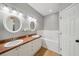 Bathroom features double vanity sinks and a pristine soaking tub perfect for relaxation after a long day at 561 Pinebranch Cir, Winter Springs, FL 32708