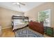 Cozy bedroom with bunk beds, dresser, and a colorful rug creating a playful and inviting space at 561 Pinebranch Cir, Winter Springs, FL 32708