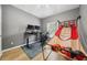 Bedroom features an interesting basketball game and modern desk for studying or gaming at 561 Pinebranch Cir, Winter Springs, FL 32708