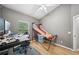 This bedroom is equipped with a modern desk and basketball game at 561 Pinebranch Cir, Winter Springs, FL 32708