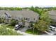 Beautiful townhouse featuring blue shutters, well-kept lawn, and a driveway, offering convenient parking spaces at 561 Pinebranch Cir, Winter Springs, FL 32708