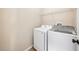 Laundry room with white washer and dryer units at 561 Pinebranch Cir, Winter Springs, FL 32708
