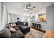 Open-concept living room with large sectional sofa, area rug and view to kitchen at 561 Pinebranch Cir, Winter Springs, FL 32708