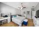 Bright main bedroom featuring a ceiling fan, ensuite bathroom and walk-in closet at 561 Pinebranch Cir, Winter Springs, FL 32708