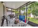 Enclosed patio with views of the lake, outdoor seating and outdoor games, perfect for relaxing at 561 Pinebranch Cir, Winter Springs, FL 32708