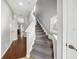 Clean, carpeted stairway leading to the upper level, enhancing the home's inviting atmosphere and design at 561 Pinebranch Cir, Winter Springs, FL 32708