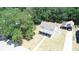 Charming two-story home with a covered parking, surrounded by lush greenery and a spacious yard at 613 Michigan Ave, St Cloud, FL 34769