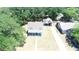 Charming two-story home with a covered front porch and car port is surrounded by lush trees at 613 Michigan Ave, St Cloud, FL 34769
