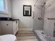 Modern bathroom featuring tiled shower with new fixtures, granite countertop, and updated vanity at 613 Michigan Ave, St Cloud, FL 34769