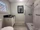 Modern bathroom featuring tiled shower with new fixtures, granite countertop, and updated vanity at 613 Michigan Ave, St Cloud, FL 34769