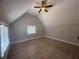Bright bedroom featuring hardwood floors, a ceiling fan, and natural light from multiple windows at 613 Michigan Ave, St Cloud, FL 34769