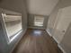 Bedroom with two windows, new floors and light grey paint at 613 Michigan Ave, St Cloud, FL 34769