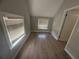 Bedroom with two windows, new floors and light grey paint at 613 Michigan Ave, St Cloud, FL 34769