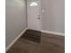 Entryway with new flooring and a door at 613 Michigan Ave, St Cloud, FL 34769
