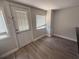 Entry area with light gray walls, new floors, and a side window at 613 Michigan Ave, St Cloud, FL 34769