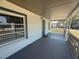 Covered porch offers protection from the elements and is a perfect spot to enjoy the outdoors at 613 Michigan Ave, St Cloud, FL 34769