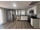 Modern kitchen with stainless steel appliances, granite countertops, and sleek flooring at 613 Michigan Ave, St Cloud, FL 34769