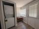 Convenient laundry room with stacked washer and dryer near window at 613 Michigan Ave, St Cloud, FL 34769