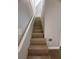 Stairway to second floor with nice wooden steps at 613 Michigan Ave, St Cloud, FL 34769